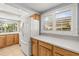 Functional kitchen with updated appliances, solid countertops, and ample natural light at 6552 River Rd, New Port Richey, FL 34652