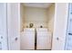 Dedicated laundry room with washer, dryer, and louvered closet doors at 6710 Hickorywood Ln # 1B, New Port Richey, FL 34653