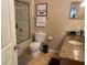 Well-lit bathroom featuring a shower, toilet, vanity with granite countertop, and neutral wall paint at 700 S Harbour Island Blvd # 413, Tampa, FL 33602