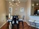 Dining area with modern chandelier and adjacent breakfast bar at 700 S Harbour Island Blvd # 413, Tampa, FL 33602