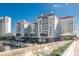Upscale waterfront condo building features a marina, lush landscaping, and a coastal community aesthetic at 700 S Harbour Island Blvd # 413, Tampa, FL 33602