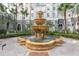 Charming tiered fountain surrounded by lush landscaping and a walkway is an appealing feature at 700 S Harbour Island Blvd # 413, Tampa, FL 33602