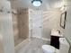 Bathroom with updated fixtures, walk-in shower, and closet at 7026 Whitethorn Ct, Port Richey, FL 34668