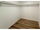 Empty closet with railing and hardwood floors at 7026 Whitethorn Ct, Port Richey, FL 34668
