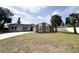 Charming single-story home featuring a stone facade, well-maintained lawn, and a paved driveway at 7026 Whitethorn Ct, Port Richey, FL 34668