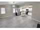 Open floor plan with the living room open to an updated kitchen with stainless steel appliances at 7026 Whitethorn Ct, Port Richey, FL 34668