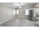 Spacious living room with vaulted ceilings and open to an updated kitchen at 7026 Whitethorn Ct, Port Richey, FL 34668