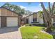 Lovely home with a well-kept yard, brick driveway, and inviting front entrance at 7522 Heather Walk Dr, Weeki Wachee, FL 34613