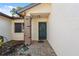 Covered front porch featuring brick accents and a charming door with decorative window at 7522 Heather Walk Dr, Weeki Wachee, FL 34613