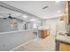 Open kitchen and living area with breakfast bar and natural light at 7522 Heather Walk Dr, Weeki Wachee, FL 34613