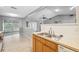 Kitchen sink with views to the sunroom and backyard at 7522 Heather Walk Dr, Weeki Wachee, FL 34613