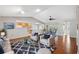 Comfortable living room with stylish furniture, hardwood floors, and an open concept design at 7522 Heather Walk Dr, Weeki Wachee, FL 34613