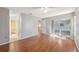 Spacious living room boasts wood floors and sliding glass doors for plenty of natural light and easy access at 7522 Heather Walk Dr, Weeki Wachee, FL 34613