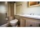 Bathroom featuring a shower, toilet, and sink with a classic design, ideal for relaxation at 846 Oakwood Dr, Tarpon Springs, FL 34689