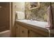Bathroom featuring a sink, mirror, and toilet with floral wallpaper adding a vintage touch at 846 Oakwood Dr, Tarpon Springs, FL 34689