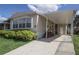 View of the carport and entry of this charming mobile home at 846 Oakwood Dr, Tarpon Springs, FL 34689