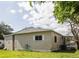 Charming single-story home with well-maintained lawn and mature shade trees at 846 Oakwood Dr, Tarpon Springs, FL 34689