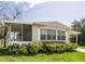 Inviting mobile home featuring a screened porch and covered parking area at 846 Oakwood Dr, Tarpon Springs, FL 34689