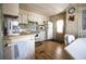 Bright kitchen featuring lots of cabinet space and tile countertops at 846 Oakwood Dr, Tarpon Springs, FL 34689