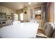 Eat-in kitchen with ample cabinet space, laminate flooring, and a white dining table at 846 Oakwood Dr, Tarpon Springs, FL 34689
