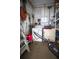 Functional laundry area features a washer, dryer and convenient shelving for storage at 846 Oakwood Dr, Tarpon Springs, FL 34689
