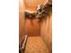 Empty walk-in closet featuring neutral-colored walls and patterned flooring, offering ample storage space at 846 Oakwood Dr, Tarpon Springs, FL 34689
