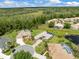 Gorgeous aerial view of the neighborhood, showcasing the lush surroundings and the spacious layout of this home at 9032 Cypress Glen Ct, Weeki Wachee, FL 34613
