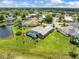 Aerial view of houses in a neighborhood with lakes and mature trees at 9032 Cypress Glen Ct, Weeki Wachee, FL 34613
