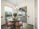 Charming breakfast nook with a glass table set, adjacent to sliding doors and offering lovely pool views at 9032 Cypress Glen Ct, Weeki Wachee, FL 34613