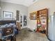 Spacious garage area with tile flooring, tall ceilings, storage shelving, and convenient access to outdoor spaces at 9032 Cypress Glen Ct, Weeki Wachee, FL 34613