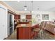 Spacious kitchen featuring stainless steel appliances, granite countertops, and an island with bar seating at 9032 Cypress Glen Ct, Weeki Wachee, FL 34613