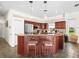 Well-equipped kitchen with stainless steel appliances, granite countertops, and an island with bar seating at 9032 Cypress Glen Ct, Weeki Wachee, FL 34613