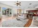 Open-concept living room showcases hardwood floors, neutral décor, and seamless access to the kitchen at 9032 Cypress Glen Ct, Weeki Wachee, FL 34613