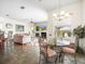 Bright open-concept living space blending kitchen, breakfast nook, and living room areas for seamless living at 9032 Cypress Glen Ct, Weeki Wachee, FL 34613