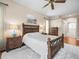 Well-lit main bedroom featuring hardwood floors and two dressers for clothing storage at 9032 Cypress Glen Ct, Weeki Wachee, FL 34613