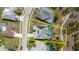 Aerial view of the property surrounded by a beautiful neighborhood and mature landscaping at 9301 Tournament Dr, Hudson, FL 34667