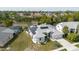 Aerial view of the home, showing the pool and solar panels at 9301 Tournament Dr, Hudson, FL 34667