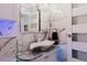 Unique bathroom with a vessel sink, marble accents, and indirect lighting creates a modern and stylish space at 9301 Tournament Dr, Hudson, FL 34667