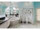 Elegant bathroom boasts a soaking tub, a glass-enclosed shower, and large mirror for a luxurious feel at 9301 Tournament Dr, Hudson, FL 34667
