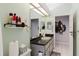 Bathroom featuring a toilet, sink with dark countertop, mirror and walk-in shower at 9301 Tournament Dr, Hudson, FL 34667