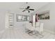 Dining room featuring tile floor, a mirrored accent wall, and glass table with six chairs at 9301 Tournament Dr, Hudson, FL 34667