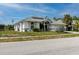 Beautiful home featuring a two-car garage, well-manicured lawn, and gorgeous front yard landscaping at 9301 Tournament Dr, Hudson, FL 34667