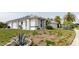 This home features solar panels and manicured landscaping, adding to its curb appeal at 9301 Tournament Dr, Hudson, FL 34667