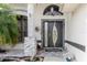 A modern front door with stone accents at 9301 Tournament Dr, Hudson, FL 34667
