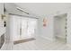 Bright, open living room with tiled floors and access to outdoor space at 9301 Tournament Dr, Hudson, FL 34667
