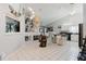 Open-concept living area showcasing kitchen, a fireplace and a wine bar at 9301 Tournament Dr, Hudson, FL 34667