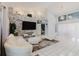 Modern living room with sleek furniture, stone accent wall, and large windows at 9301 Tournament Dr, Hudson, FL 34667