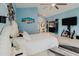 Comfortable bedroom with a king-size bed, a TV, and a vanity providing a relaxing and inviting atmosphere at 9301 Tournament Dr, Hudson, FL 34667