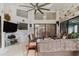 Bright sunroom featuring wicker furniture, a decorative wall, and a relaxing atmosphere at 9301 Tournament Dr, Hudson, FL 34667