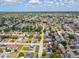 Vast aerial view displaying the home's location amid a sprawling suburban landscape with ponds at 9316 Whitman Ln, Port Richey, FL 34668